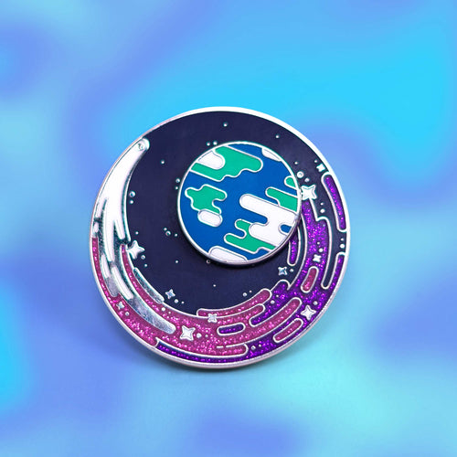 Circular Limited Edtion Pin fwith space-themed design on a gradient blue and purple background